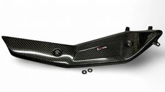Carbon fiber exhaust guard for Husqvarna 701 motorcycle, featuring a sleek black design with a Wolfcarbon logo.