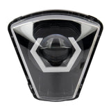 Black and silver car headlight on a white background